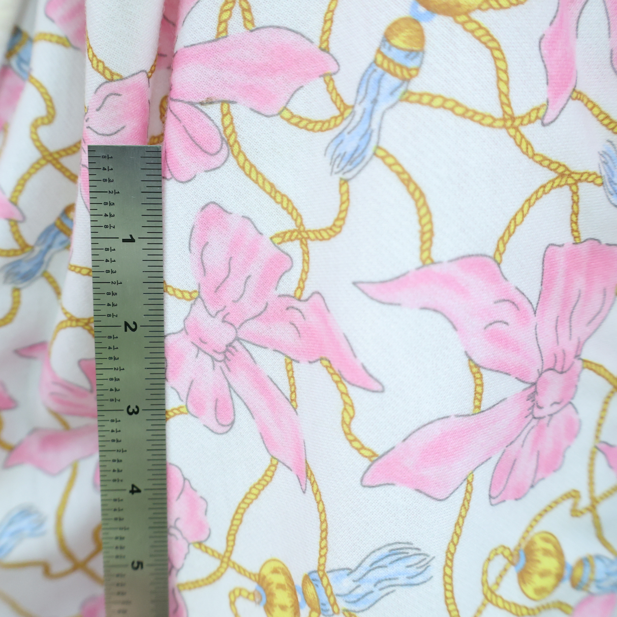 Cotton Poly Brushed Back Fleece Pink Bow & Rope Pattern Fabric - By The Yard